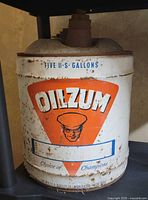 Front of can showing Oilzum logo, capacity marking