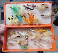 Open case showing top and bottom foam panels with assorted flies