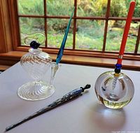 Overall view of three pens and two glass inkwells