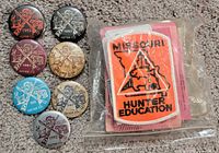 Seven hunting buttons and Missouri Hunter Education patch in bag
