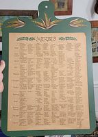 Full view of wooden plaque showing herbs chart and painted wheat motif