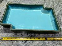 overview of planter with tape measure showing length