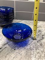 Stack and single cereal bowl with tape measure for scale