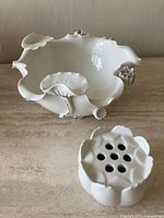 Overall view of white ceramic footed bowl with removable flower frog insert