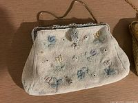 White beaded floral purse front view