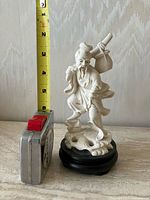 front view showing full fisherman figure with measuring tape