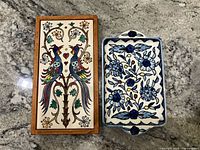 Front view of both items showing painted designs