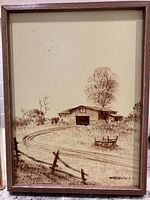 Full view of framed sepia barn landscape painting