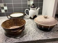 Group shot of coffee pot and three casserole dishes