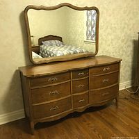 Low nine-drawer dresser with attached mirror