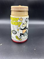 Front view showing Sport Goofy title and tennis graphic on thermos