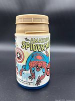 Front view showing Spider-Man artwork and lid