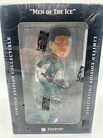 Front of sealed box showing Jaromir Jagr bobblehead inside and series title