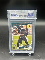 Front of graded Jalen Hurts rookie card in EGA slab, label showing 10 Exquisite grade