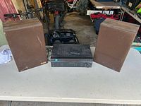 Front view of Sony STR-DE197 receiver flanked by two Advance speakers