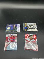 Overview of all four hockey cards in lot
