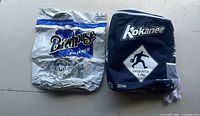Front view of both branded cooler bags showing logos and overall condition