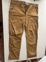 Front view of Carhartt brown canvas work pants