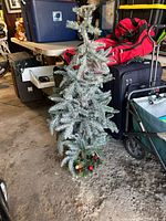 Full view of artificial Christmas tree standing on floor