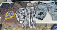 All six clothing items laid out on table