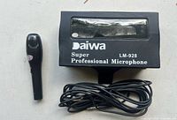 Microphone, cable and original Daiwa box visible
