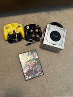 All items grouped: console, two controllers, power cable, game case