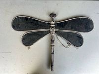 Front view of full wooden dragonfly decoration showing wings, body, hanging cord