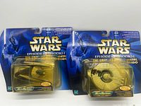 Front view of both sealed Micro Machines packages