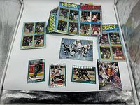 Assorted loose hockey cards and a flattened wax box top showing design details