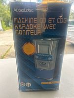 Front of original box displaying AudioLogic ALKRG11 karaoke machine