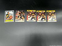 Five Mario Lemieux cards laid out