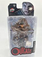 Front of sealed blister pack showing figure and Outcast logo