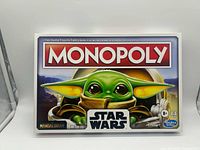 Front of Monopoly Star Wars The Child Edition box showing artwork, branding, age rating