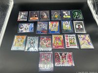 All 17 sleeved rookie cards arranged on black background