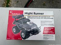 sealed box showing RadioShack Night Runner RC truck branding and artwork