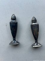 Front view of both urn-style shakers