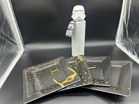 Overall group of three plastic plates and Stormtrooper water bottle