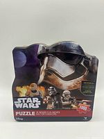 Front of Star Wars 1000-piece puzzle tin showing artwork, piece count and size
