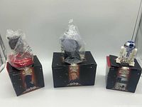 Three boxed Star Wars Episode I toys: Darth Maul, Planet Coruscant sphere, R2-D2