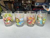Front view of four Shrek the Third promotional glasses