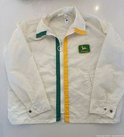 Full view of front of jacket showing stripes and pockets