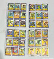 Overview of first four binder pages of Digimon cards