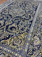 Oblique angle close-up of central medallion and field motifs