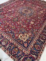 Full view of Mashhad rug showing entire design and dimensions