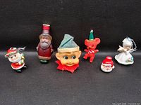 All six vintage Christmas items on black background