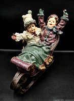 Front angle of Kirkland sleigh showing two children and glitter finish