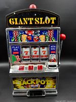 Front view showing reels, graphics, buttons and overall design