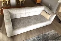 Full view of sofa showing upholstery colour and overall design