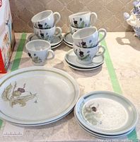 Group shot of cups, saucers, dessert and dinner plates