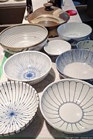 Group shot of all bowls and donabe pot